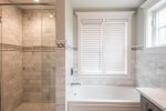 Separate tub and shower in en-suite bathroom